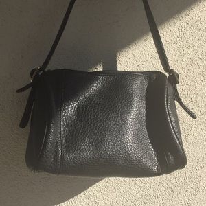 Black faux leather shoulder bag.